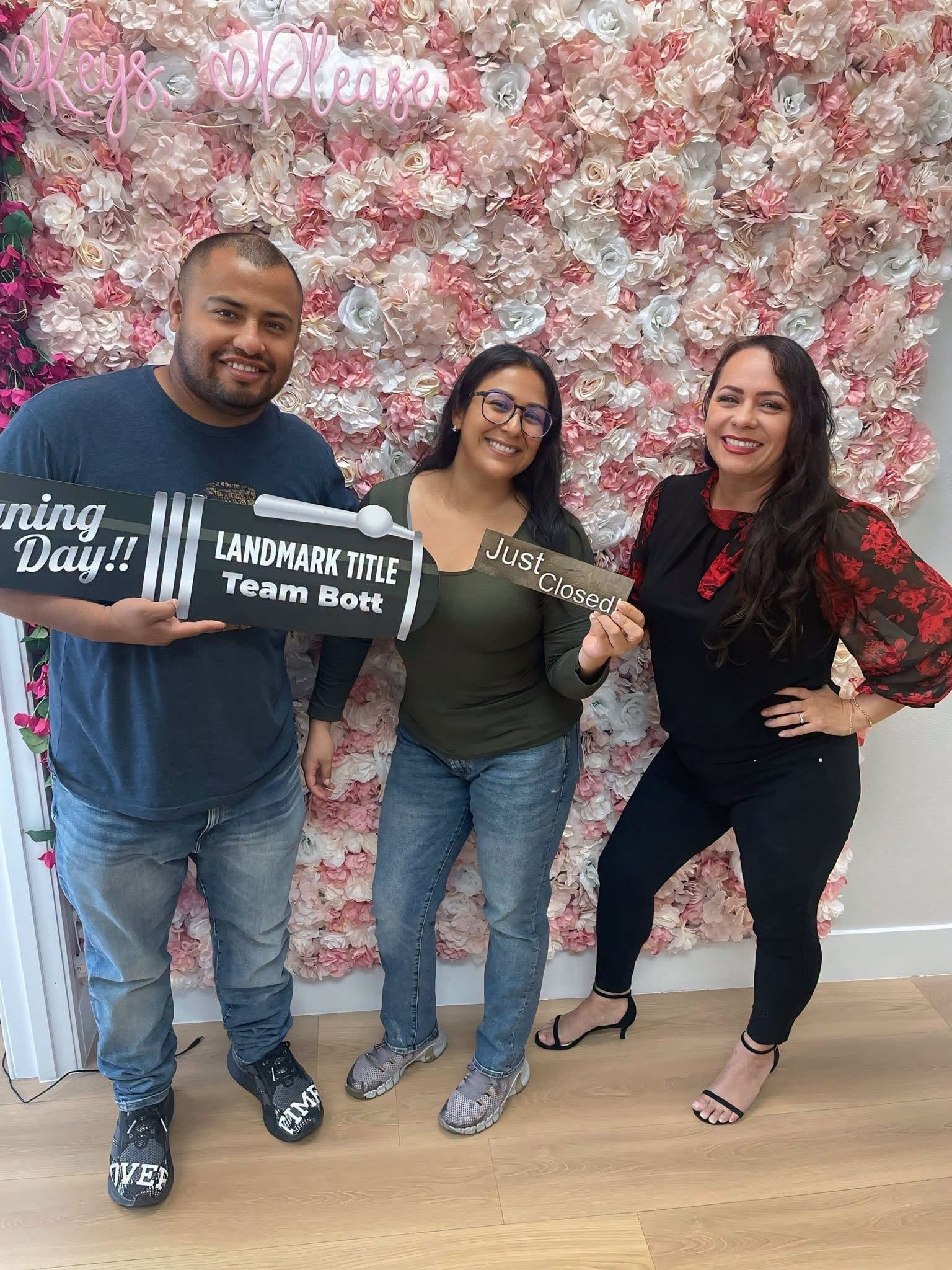 Happy family celebrating closing day with Rita at Landmark Title
