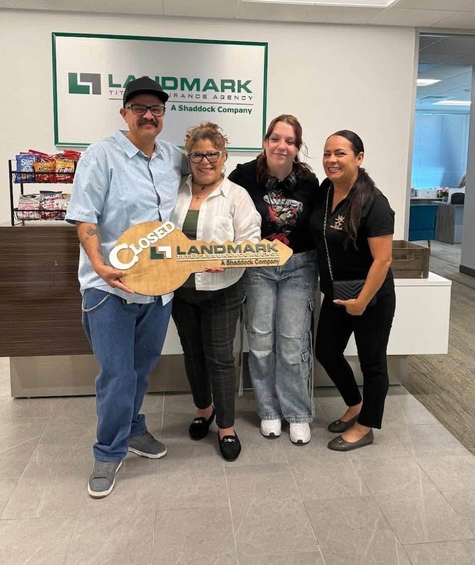 Family at Landmark Title closing with Rita